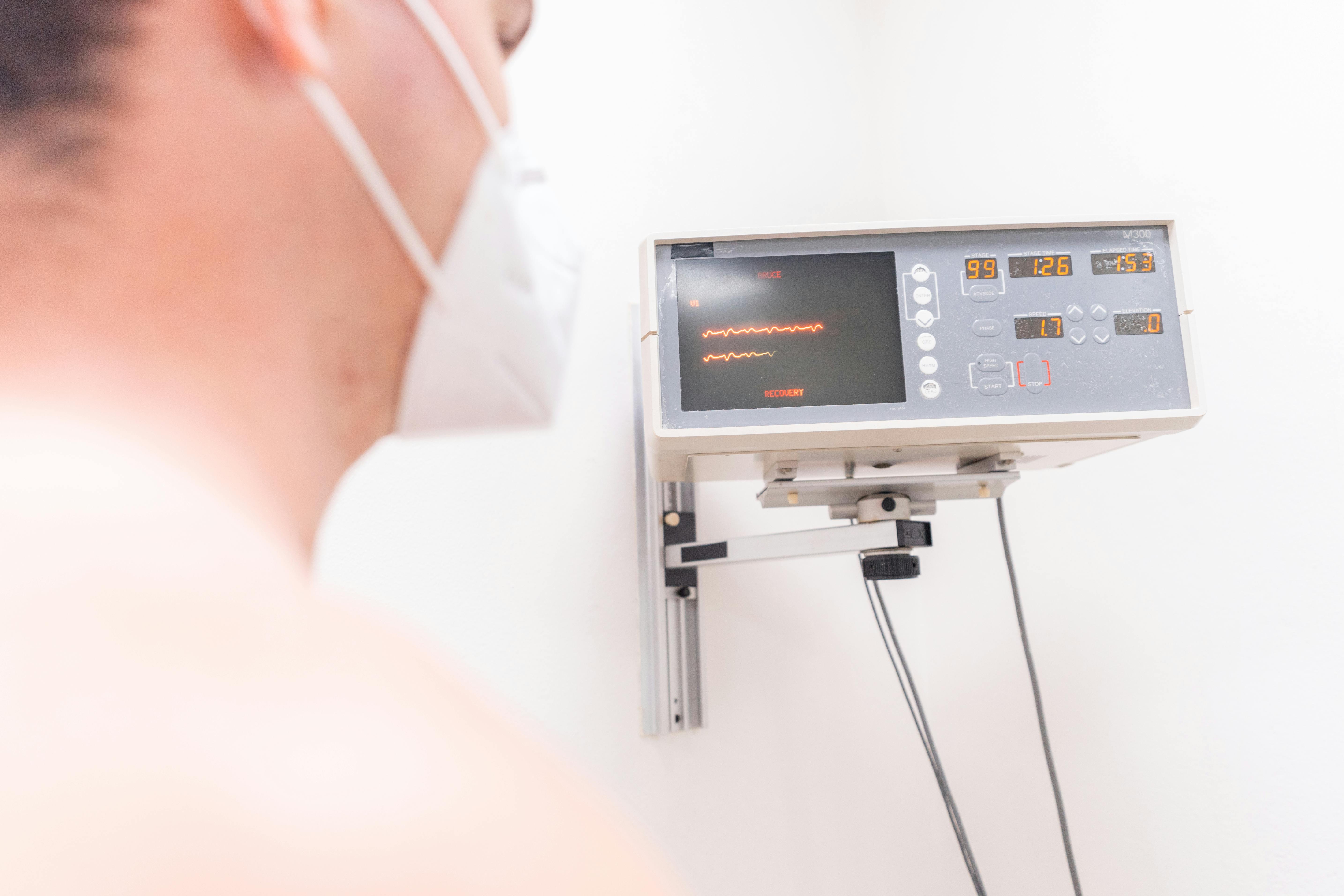 Nurse explaining heart diagnosis in cardiology to senior woman on tablet pc