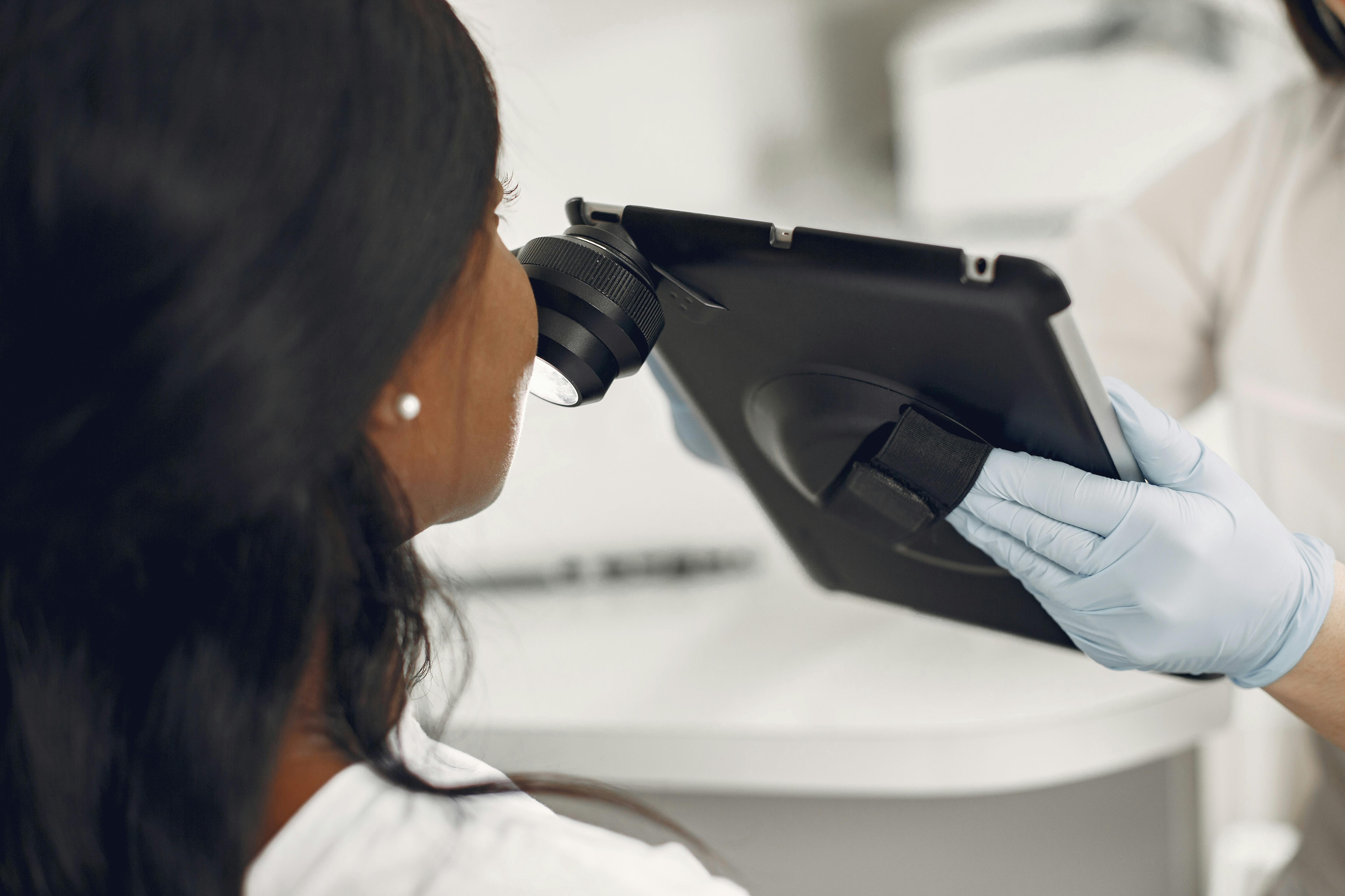 Dermatologist injecting a cheek filler to a woman
